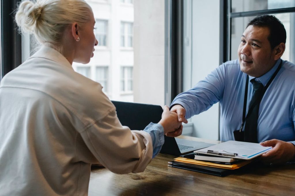 Man Shaking hand with woman